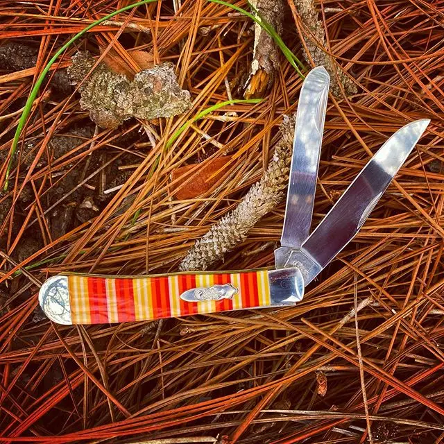 Case Candy Stripe Corelon Trapper CA9245CY.  This knife looks good enough to eat- if you love candy corn! Case knows how to produce a good treat. #candystripeknives #caseknives #orangehandleknives #corelon #trapper