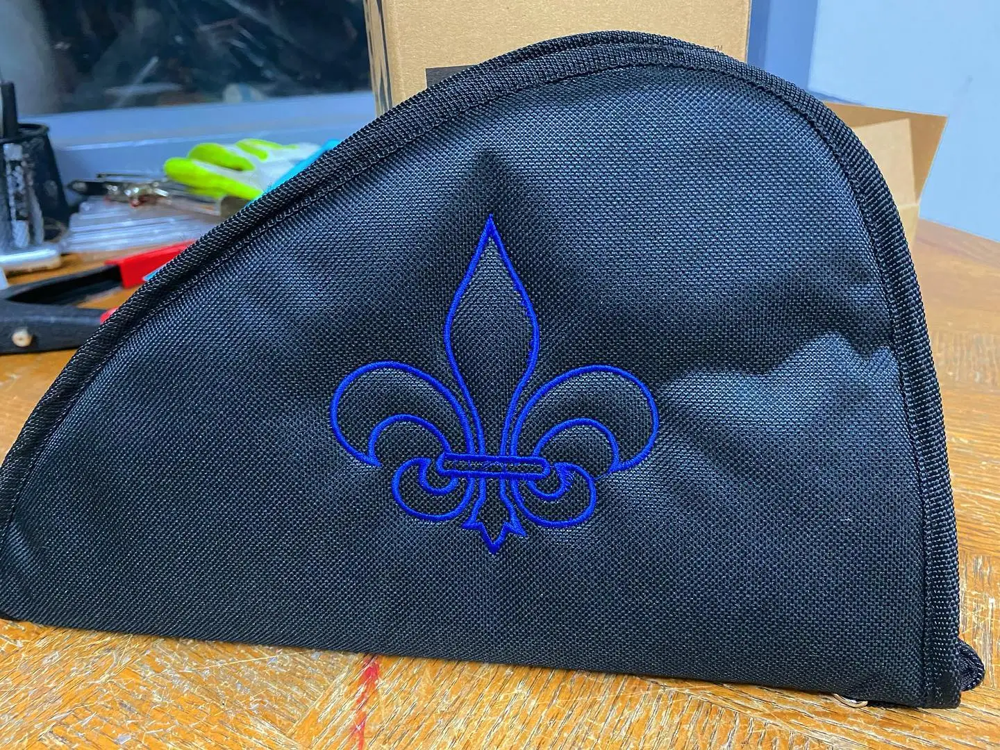 Embroidered gun carrying case with a blue Fleur de Leis.  We can customize your case to any image or text desired.
#guncase #embroideredguncase #fleurdeleis #customizedguncase