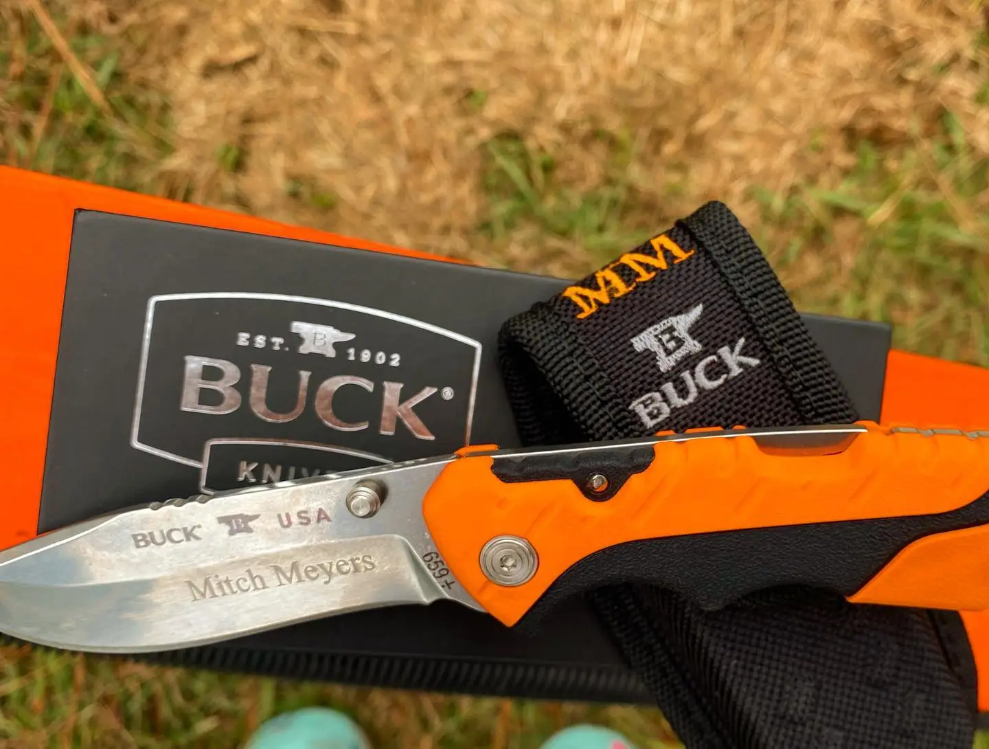 Buck Pursuit Pro lockback knife BU659ORS. We engraved knife blade with name and Initials on black sheath that does come with this knife. Nice bright Orange color. #bucklockback #pursuit #engravedknife #buckknives